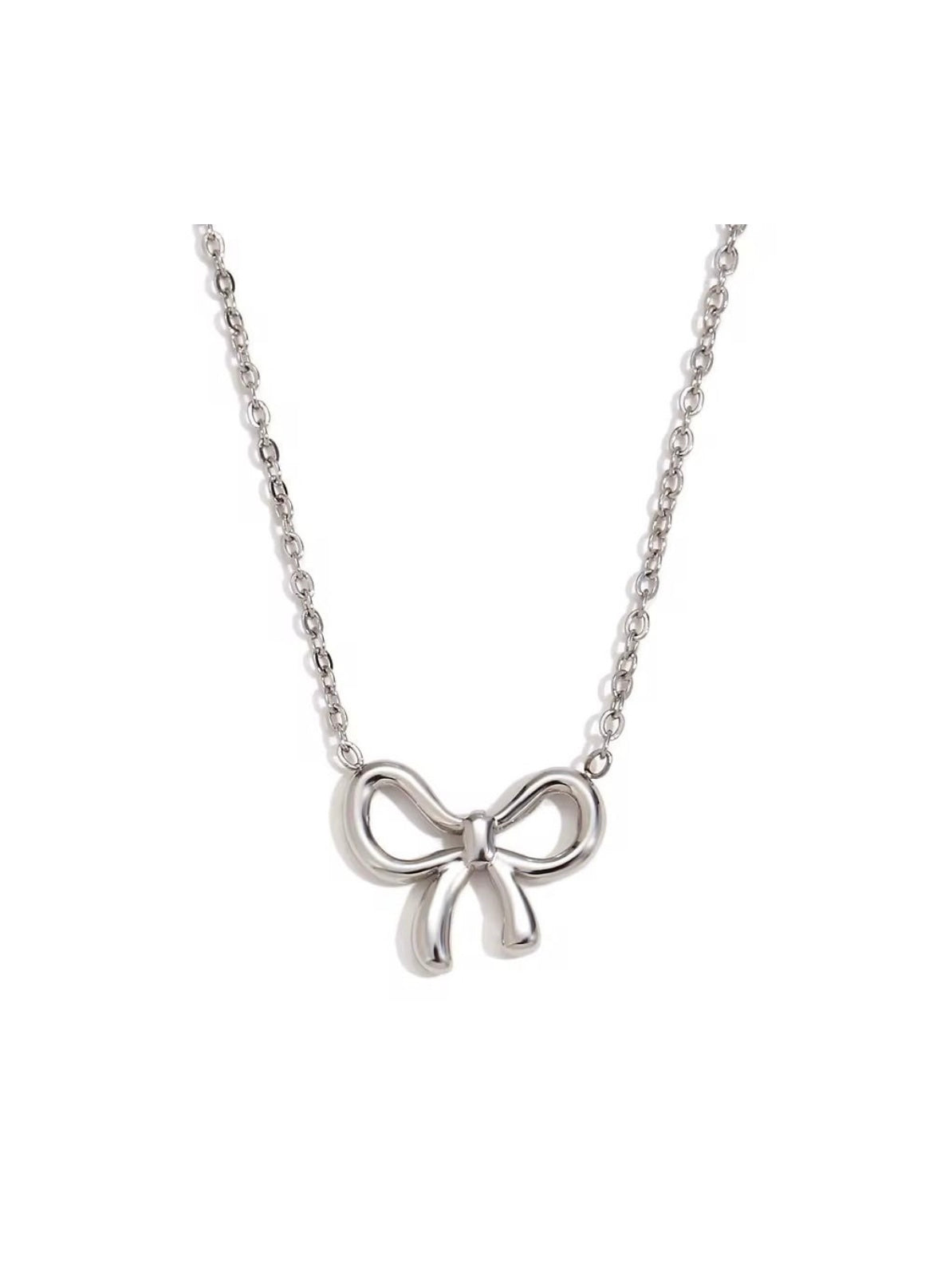 ID:0029 | Set de lazos plateado (Colgante + Aretes)
